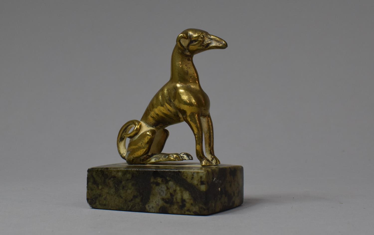 A Small Brass Study of a Seated Greyhound on Rectangular Marble Plinth with Paper Label Inscribed