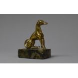A Small Brass Study of a Seated Greyhound on Rectangular Marble Plinth with Paper Label Inscribed