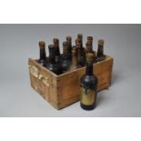 An Australian Cheese Box Containing 12 Bottles of Harveys Amontillado 1951 and 1954 Sherry