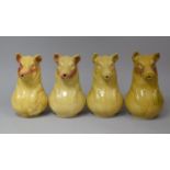 A Set of Four Glazed Stoneware Cider Jugs in the Form of Pigs, Each 22.5cm High
