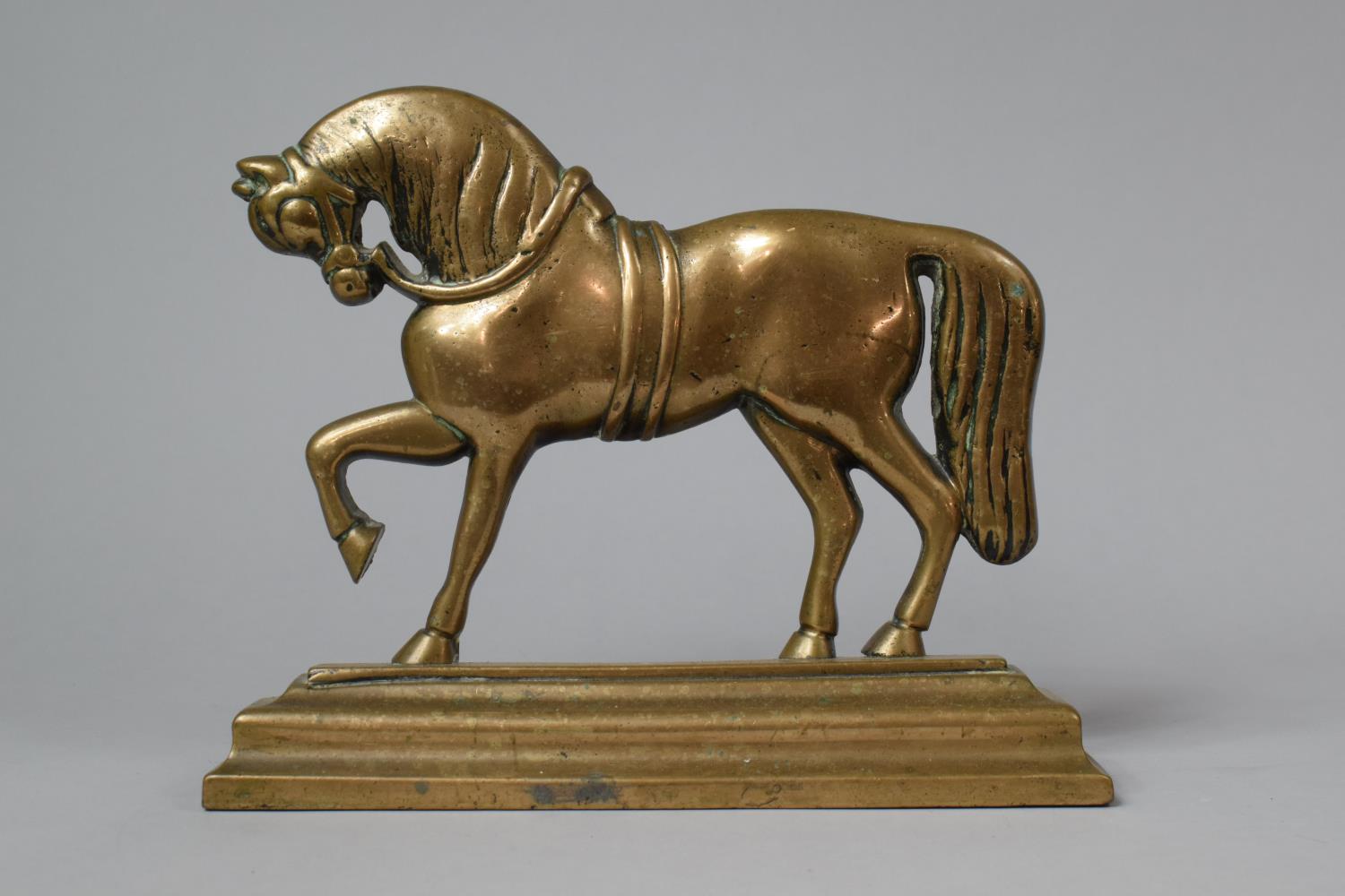 A 19th Century Bronze Fireside Ornament/Doorstop in the Form of a Prancing Stallion on Rectangular