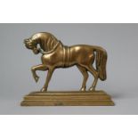 A 19th Century Bronze Fireside Ornament/Doorstop in the Form of a Prancing Stallion on Rectangular