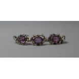 A Victorian Three Section Amethyst and Silver Brooch on Later Five Section Chain to Form a Bracelet