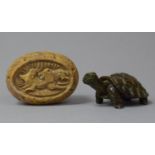 A Carved Oval Soapstone Paperweight Depicting Lion Attacking Antelope Together with a Green