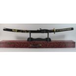 A Cased Japanese Katana with Lacquered Scabbard Decorated with Dragons, Wall Hanging Rack etc