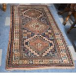 A Patterned Woollen Rug, 186cmx102cm