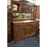 An Arts and Crafts Influenced Mirror Backed Sideboard, The Base with Two Long Drawers Over