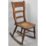 A Late 19th Century Ladder Back Rocking Chair