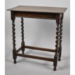 An Edwardian Oak Rectangular Occasional Table with Barley Twist Supports and Gadrooned Edging, 58.