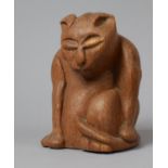 A Carved Wooden Humorous Study of a Seated Morose Cat, The Base Monogrammed BJ 1974, 18cm high