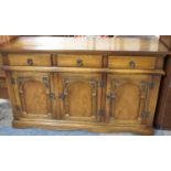 A Mid 20th Century Three Drawer Sideboard with Cupboard Base