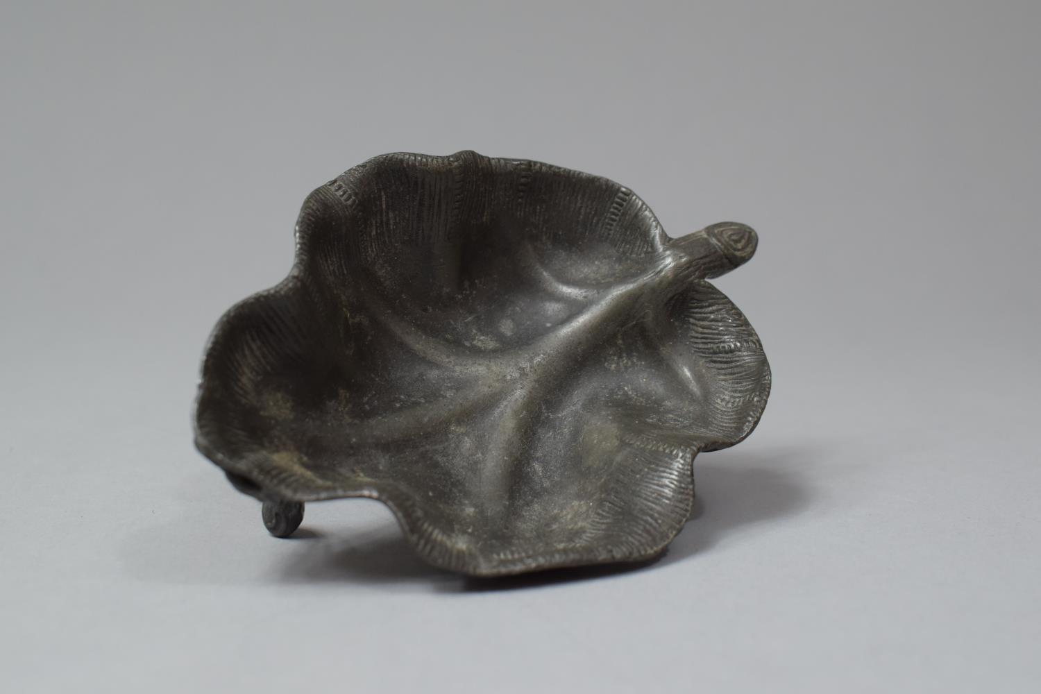 A Late 19th/Late 20th Century Oriental Pewter Novelty Dish in the Form of a Leaf on Three Scrolled