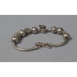 A Silver Bracelet with Charms, Stamped 925