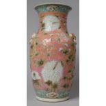 A 19th Century Chinese Vase in the Famille Rose Pallette with Dragon and Floral Design on Pink