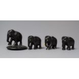 A Collection of Four Small Carved Ebonised African Elephants (With Losses)