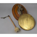 An Edwardian Wall Hanging Dinner Gong with Horse's Head Support and Original Clapper, 30cm high
