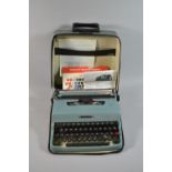A Vintage Cased Letter 32 Manual Portable Typewriter with Instructions