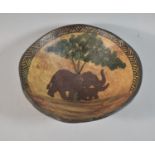 A Modern African Carved Wooden Souvenir Bowl Depicting Elephants Under Tree, 28cm Diameter