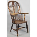 An Elm Seated Hooped Back Windsor Armchair with Pierced Splat