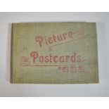 A Vintage Postcard Album Containing 24 Risque Postcards