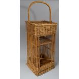 A Modern Wicker Tantalus Stand with Loop Handle, 81cm High