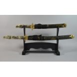 A Pair of Reproduction Dragon Headed Gilt Mounted Japanese Sword on Stands, Longest 75cm