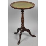 A Small Leather Topped Tripod Wine Table, 33cm diameter