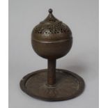 An Early 20th Century Islamic Brass Incense Burner of Globular Form on Circular Tray, 20cm high