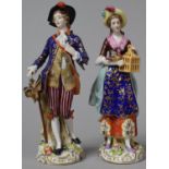 A Pair of Continental Porcelain Ornaments, Dandy and Girl with Bird Cage, Each 16cm high