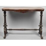 A Victorian Walnut Serpentine Shaped Side Table on Turned Supports with Scrolled Seet, 97cm Wide