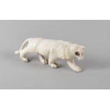 A Carved Indian Ivory Study of a Snarling Lion, 13cm Long