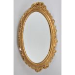 A Mid 20th Century Ornate Gilt Plaster Framed Oval Wall Mirror, 47x34cm Overall