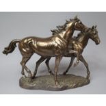 A Bronze Effect Sculpture Depicting Two Horses, One with Tail Glued, 46cm Long