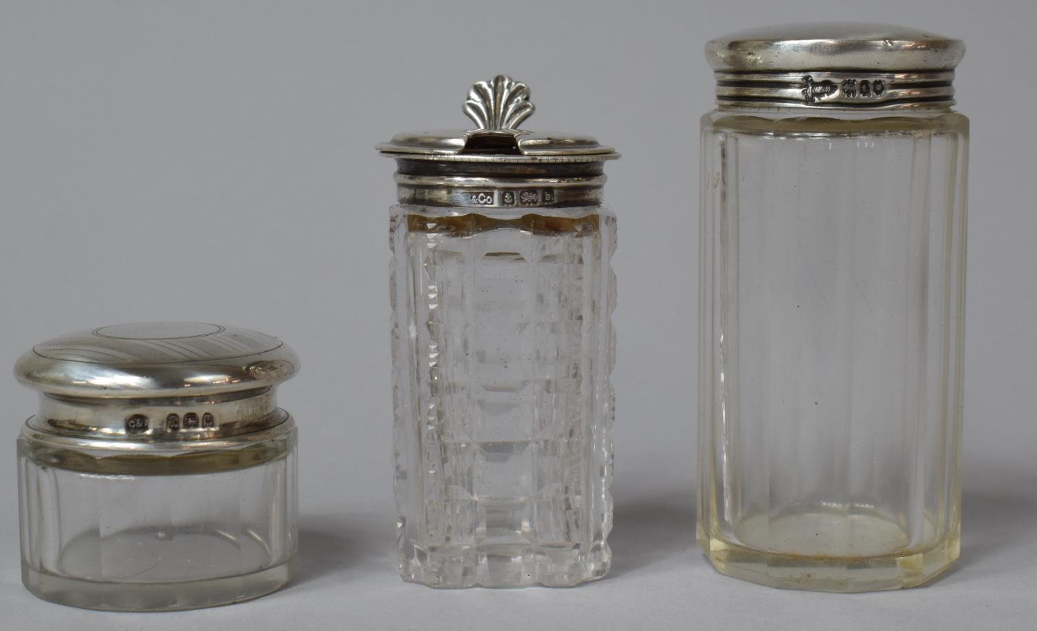 A Collection of Three Silver Topped Glass Dressing Table Pots, Hallmarked for Birmingham and London