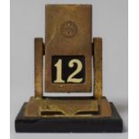 An Edwardian Desk Top Date Indicator with Revolving Mechanism to Change Date Automatically, 9cm high