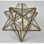 A Modern Brass Framed Tealight Holder in the Form of a Star, 22cm High