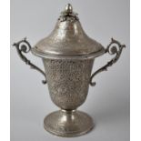 An Indian Silver Two Handled Vase and Cover with Intricate Repousse Work Decoration Depicting