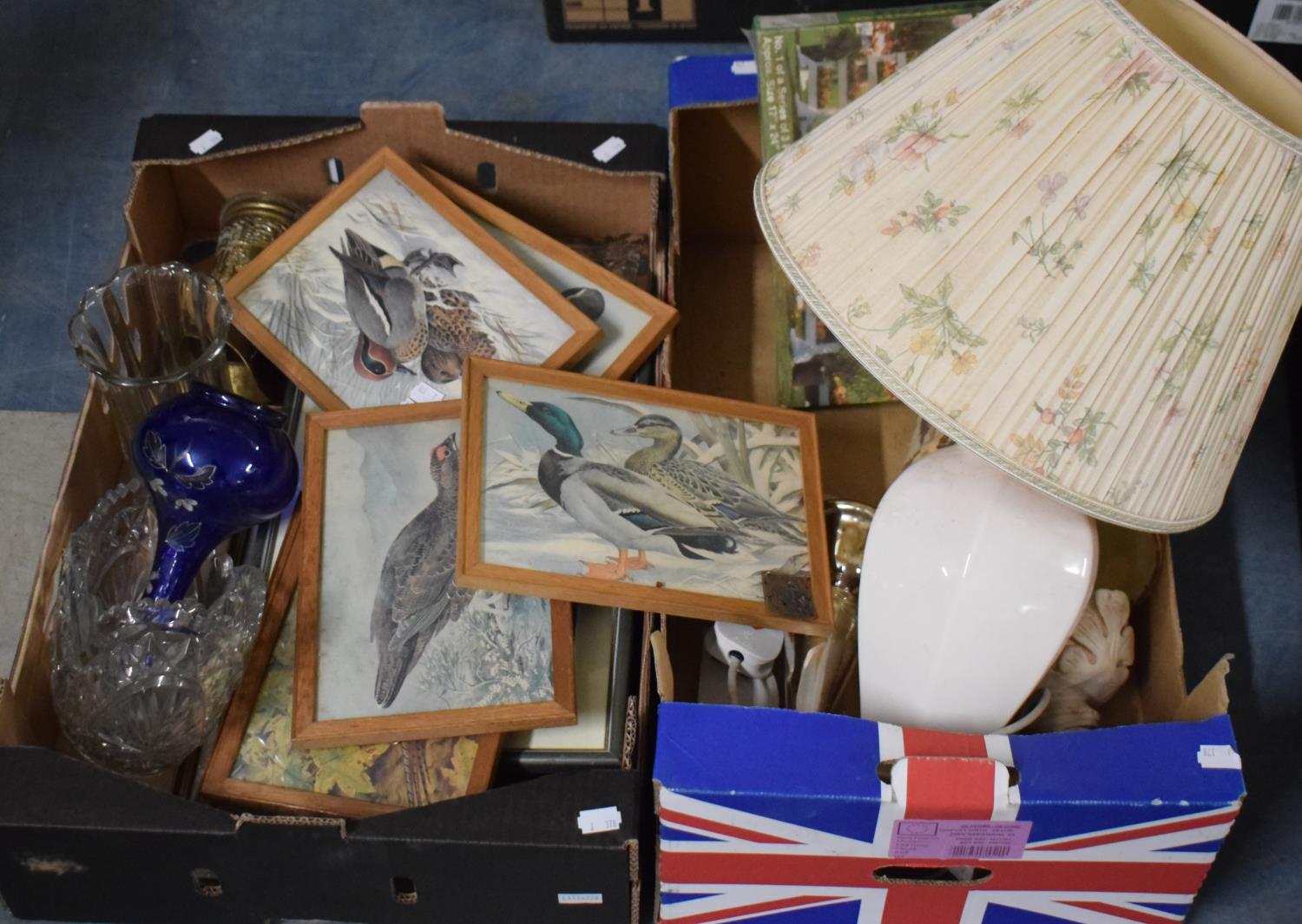 Two Boxes of Sundries to Include Jigsaw Puzzles, Framed Prints, Glasswares etc