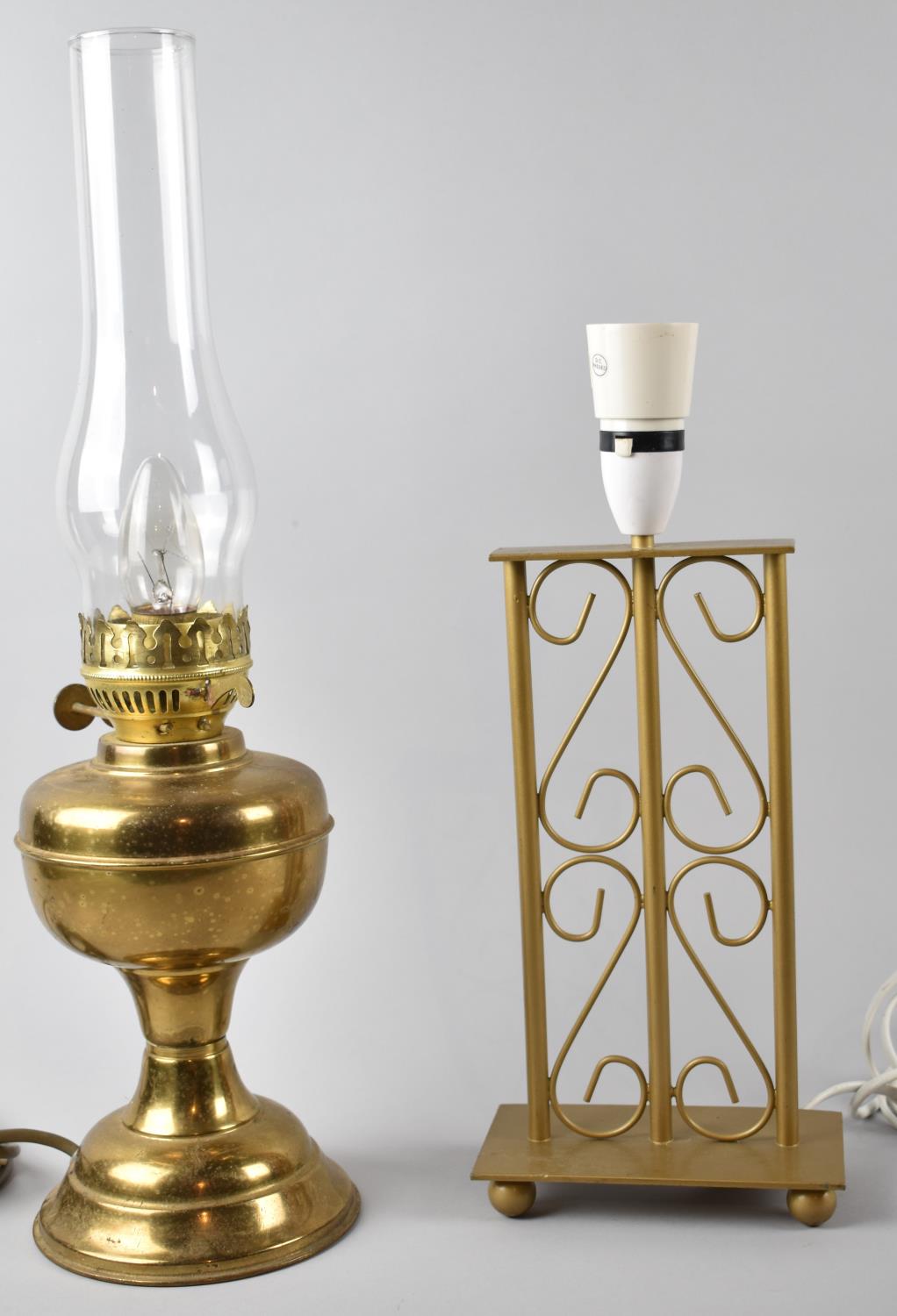 A Modern Metal table Lamp and a Brass Table Lamp in the Form of an Oil Lamp with Chimney