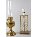 A Modern Metal table Lamp and a Brass Table Lamp in the Form of an Oil Lamp with Chimney