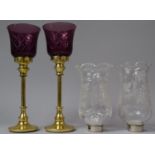 A Pair of Brass Based Coloured Glass Tealight Stands Together with Pair of Etched Glass Shades,