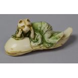 A Japanese Novelty of a Robed Cat Riding a Catfish, 9cm Long