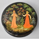 A 20th Century Circular Laquered Box Decorated in Multi Coloured Enamels with Fairy Story Motif,