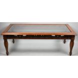 A Modern Mahogany Framed Coffee Table with Glazed Top, 119cm Wide