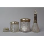 A Collection of Four Silver Mounted Glass Dressing Table Pots and a Scent Bottle