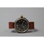 A WWI Military Wrist Watch with Black Face, Working Order