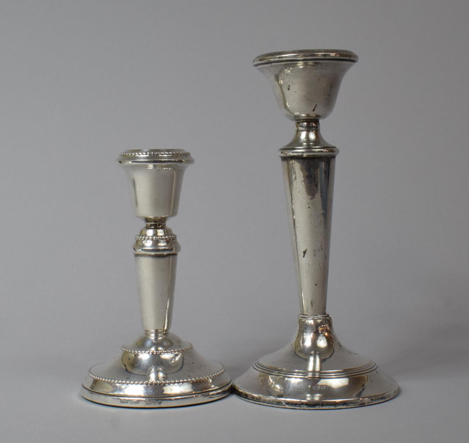 Two Filled Silver Candlesticks, Birmingham 1984, 11cm high and London 1915, 15cm high, has Been