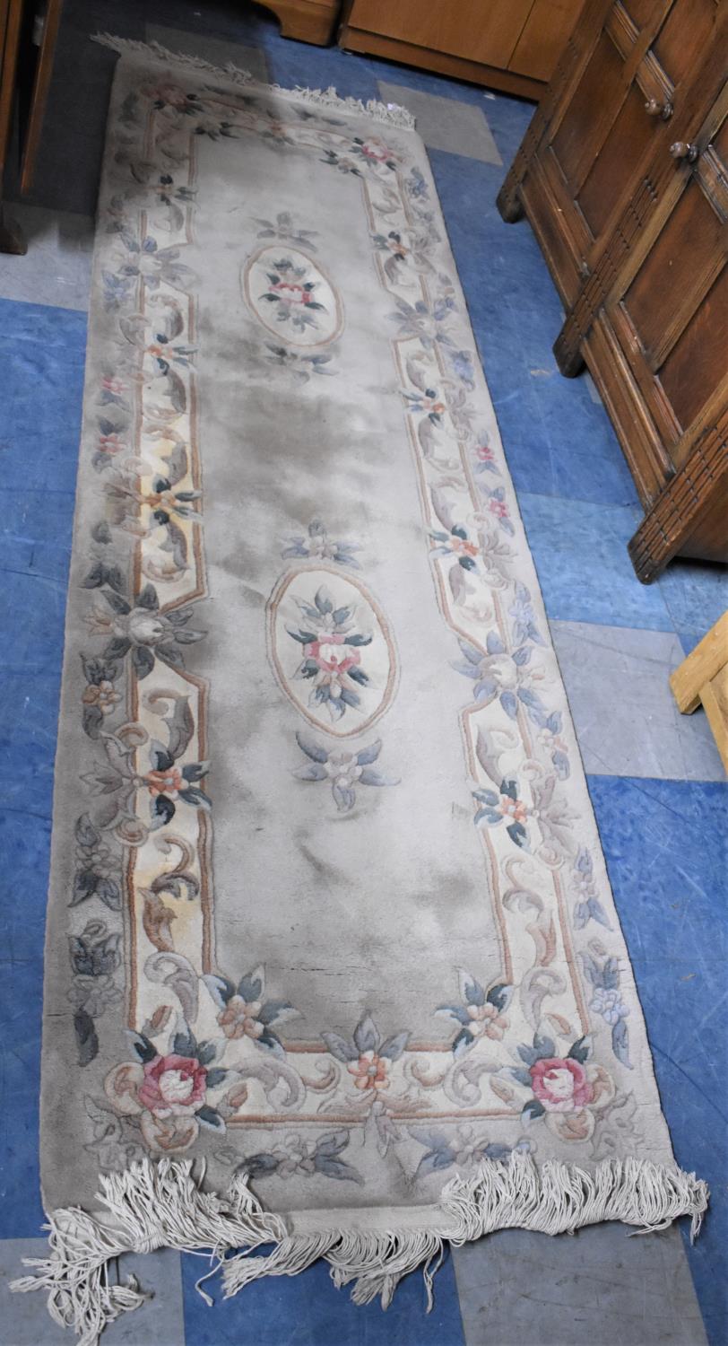 A Patterned Chinese Woollen Runner, 243x75cm