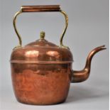 A Large Copper Kettle with Brass Finial, 30.5cm high