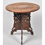 An Intricately Carved Indian Circular Topped Table on Folding Tripod Support, 46cm Diameter